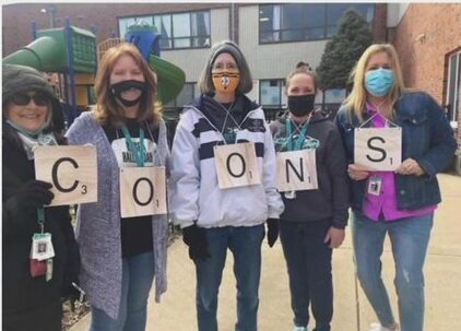 Christian School District teachers spelling the word 'coons' during a game of human Scrabble has been reported by parents as a racial slur.